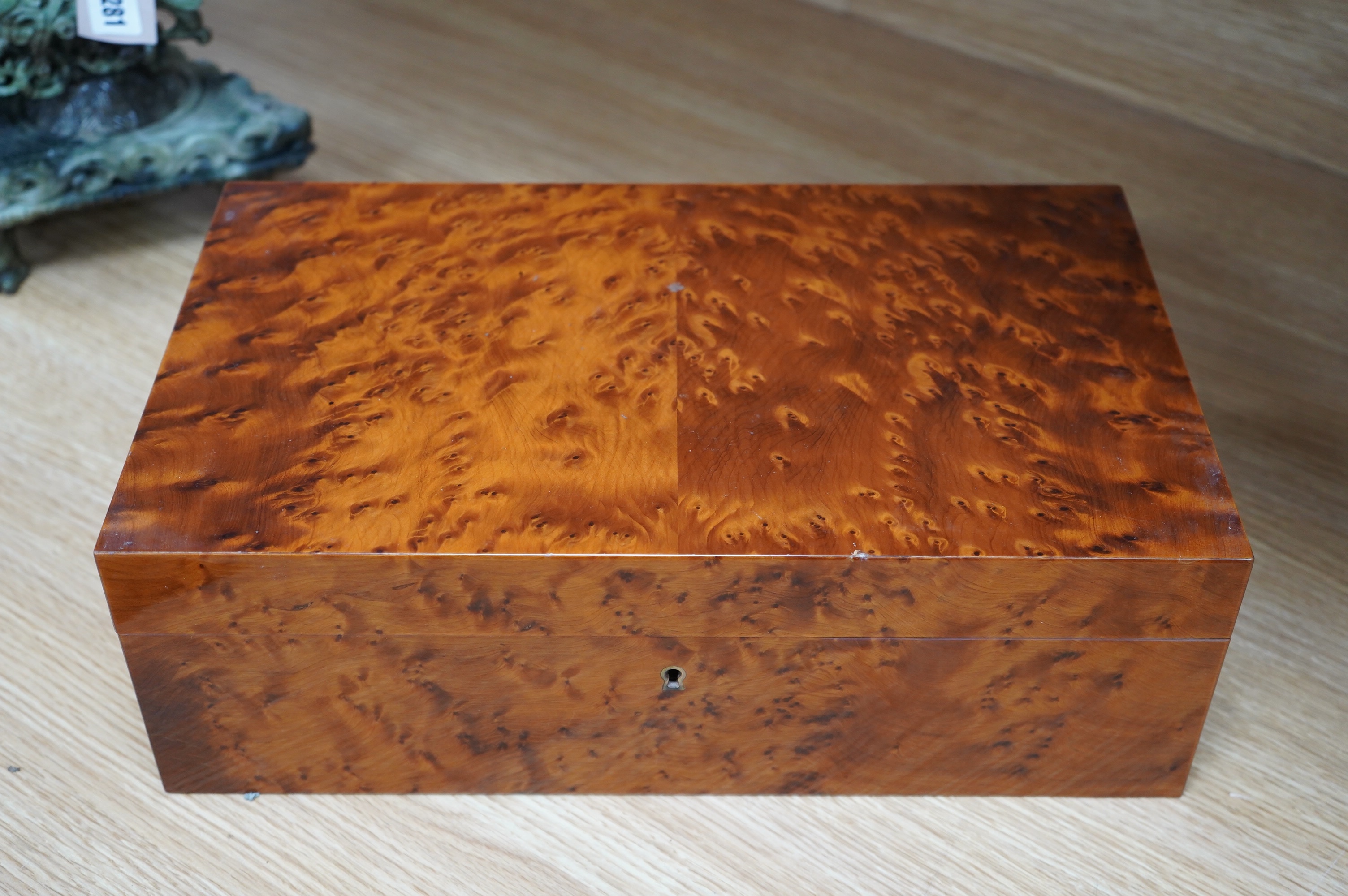 A burr walnut humidor and an Indonesian, possibly Javan, carved wood box, largest 39cm wide. Condition - fair to good